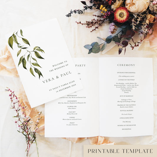 Flat-lay of a printable greenery wedding ceremony booklet template. The editable wedding program cover reads “Welcome to the Wedding of Vera & Paul”, styled with dried flowers and soft fabric on a cream backdrop.