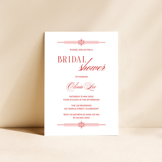 Modern red old-world style bridal shower invitation card on a beige background.