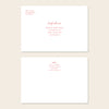 Two white invitation envelopes with address text on a beige background.