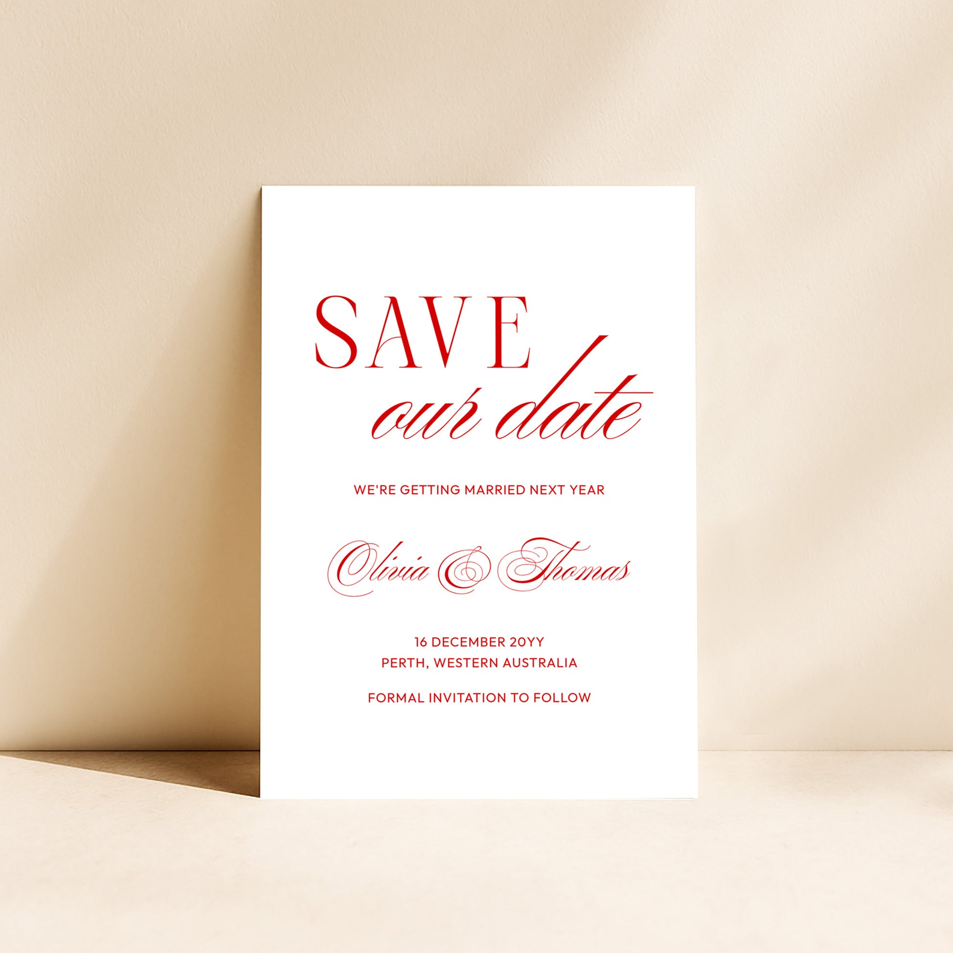 Heritage save the date card standing upright on a neutral background.
