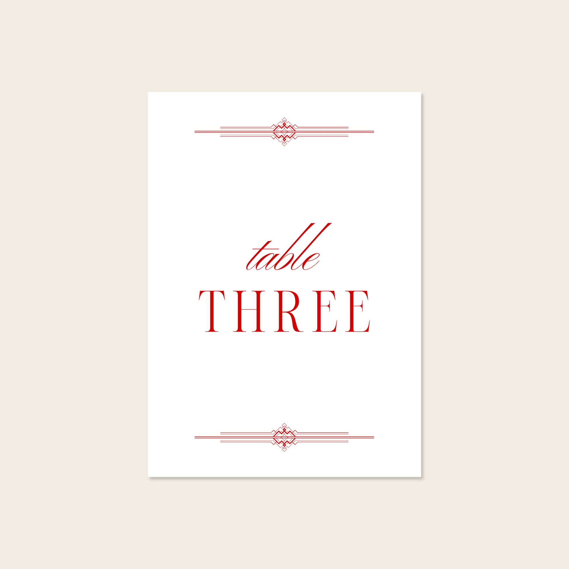 Wedding printable table number template design on a beige background.