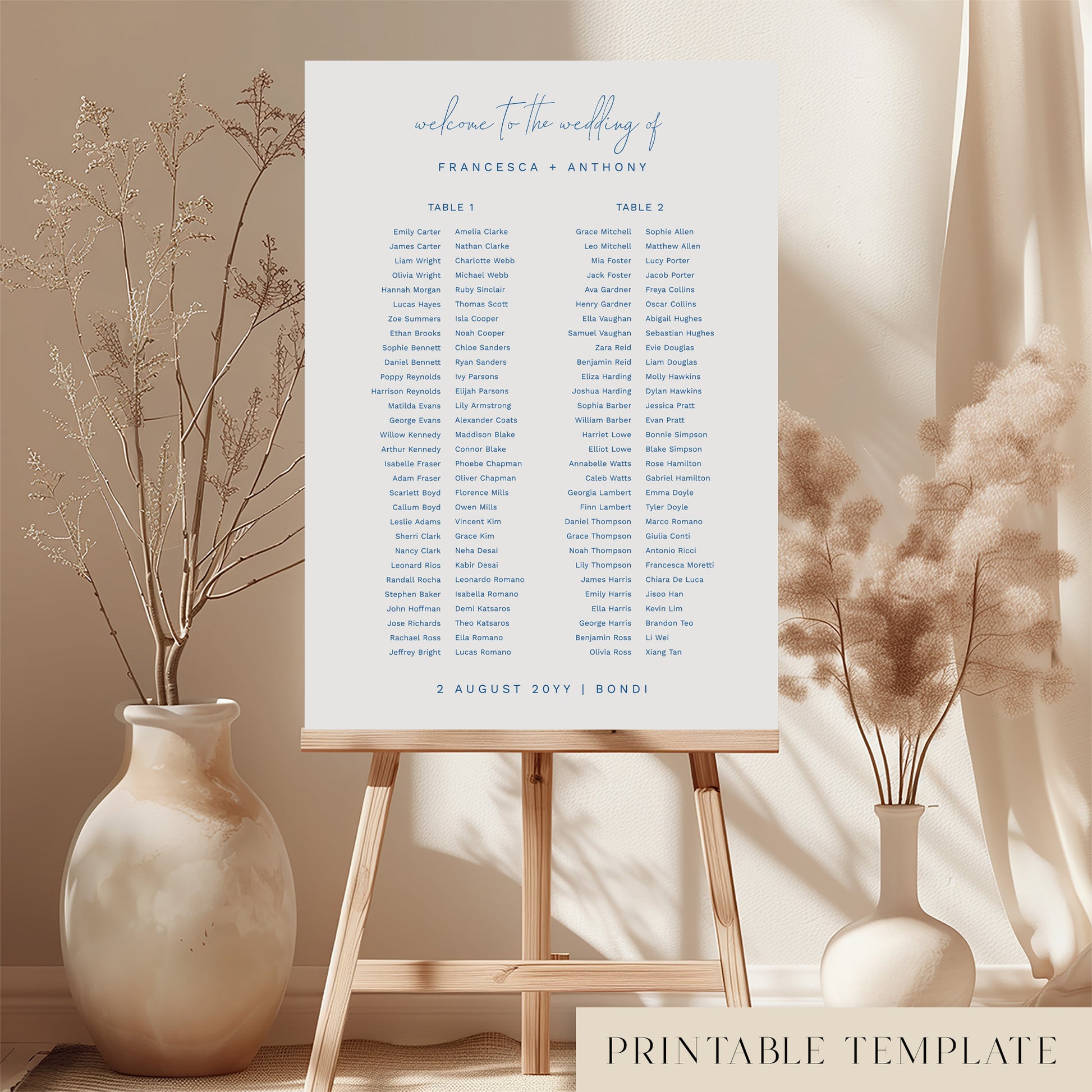 Printable minimal wedding seating chart sign on an easel with floral arrangements in a room setting.