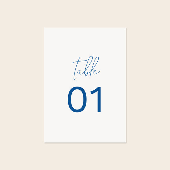 Wedding printable table number template design on a beige background.