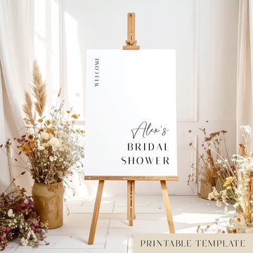 Bridal shower printable welcome sign template with floral decorations and a wooden easel.