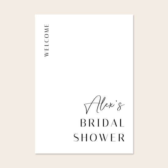Printable white bridal shower welcome sign on a beige background.