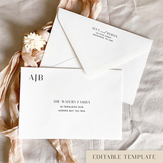 Modern wedding envelope address template with front and back printing, an A|B monogram and black text, styled with blush ribbon and a dried flower.