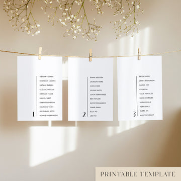 Three white seating chart cards with printed names, clipped to a string with pegs, against a neutral background.