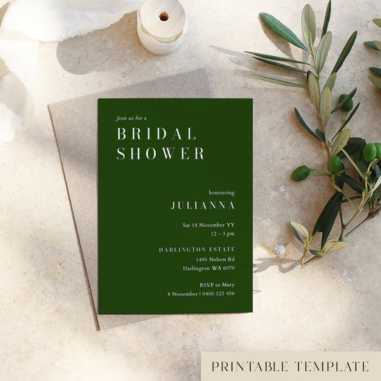 Bridal shower invitation card on a textured surface with olive branches