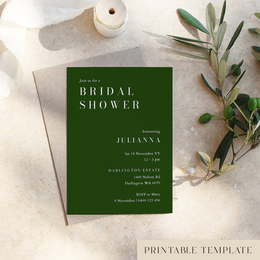 Bridal shower invitation card on a textured surface with olive branches