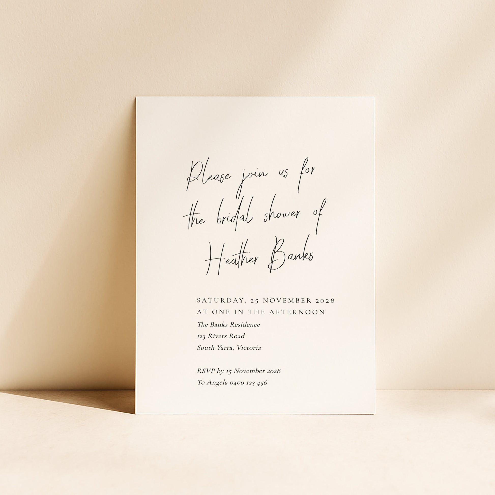 Modern bridal shower invitation card on a beige background.