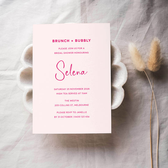 Pink bridal shower invitation card for a brunch and bubbly party.