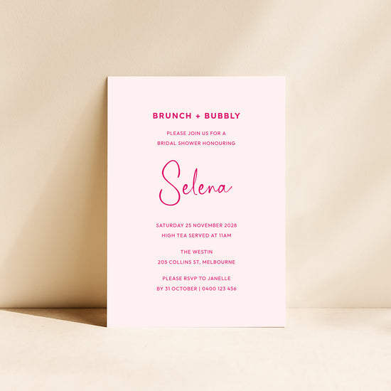 Bridal shower invitation card with pink text on a beige background.