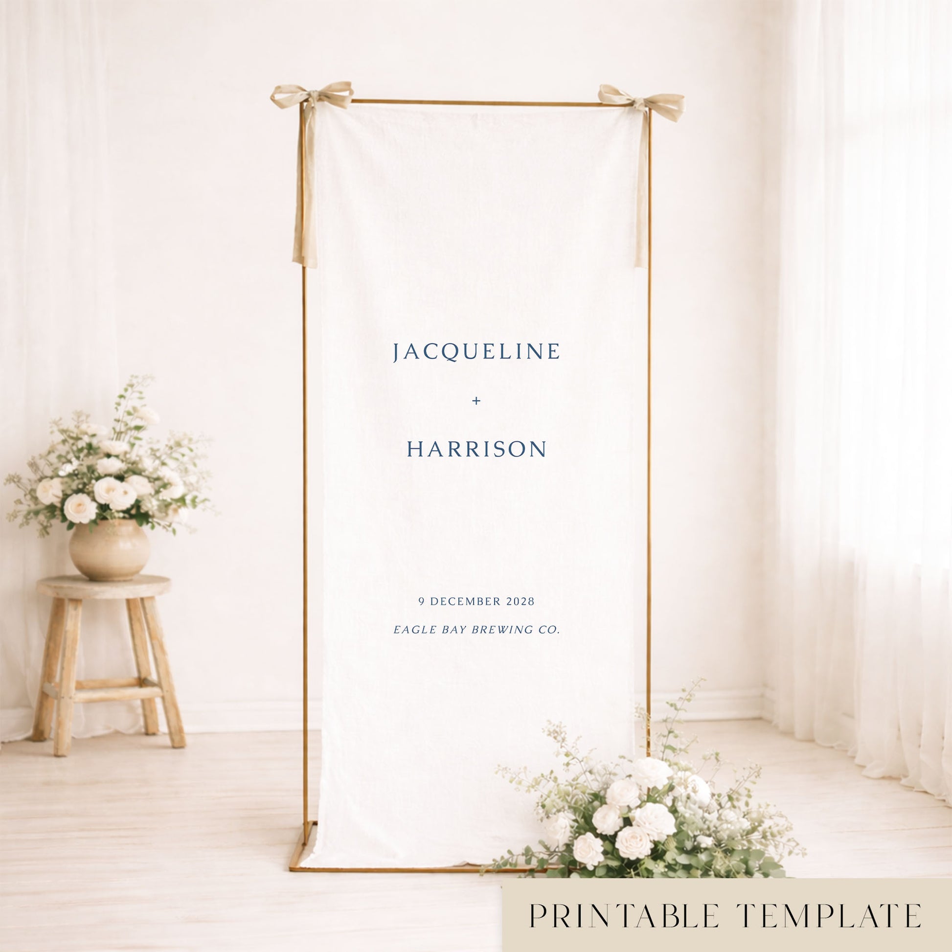 Gold frame with a hanging minimal white linen wedding welcome sign