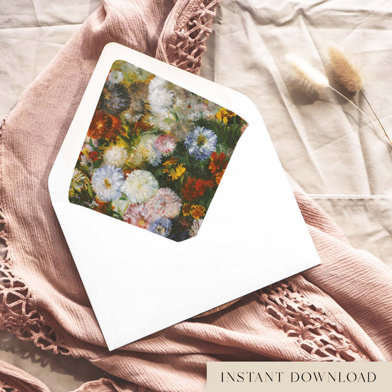 Printable Degas floral envelope liner for 5x7 wedding invitations, with painted white, lilac and blush pink asters among rust and marigold blooms, shown inside a white envelope on dusty pink fabric.