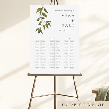Editable 3-long-table wedding seating chart on an easel, with hand-painted botanical foliage and guest names organised across three columns