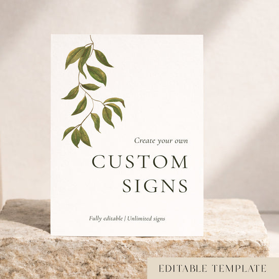 Botanical Evergreen editable wedding signs template with a hand-painted green leaf branch on a white custom sign, styled on a cream stone block. DIY and Canva friendly.