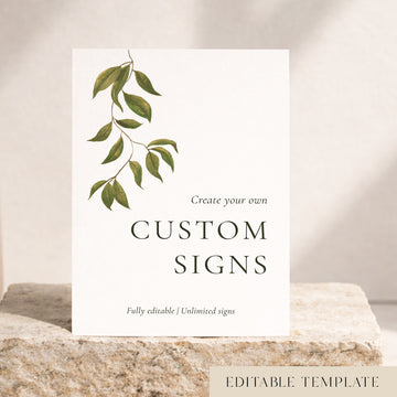 Botanical Evergreen editable wedding signs template with a hand-painted green leaf branch on a white custom sign, styled on a cream stone block. DIY and Canva friendly.