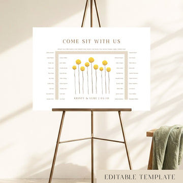 46-guest U-shape wedding seating chart template with hand-painted yellow billy button wildflowers, displayed on a bronze easel, fully editable in Canva.