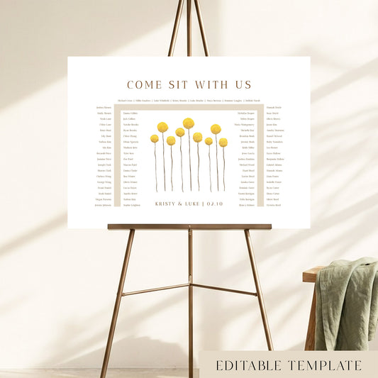 78-guest U-shape wedding seating chart template with hand-painted yellow billy button wildflowers, displayed on a bronze easel, fully editable in Canva.