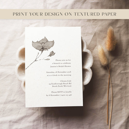 Bridal shower invitation card with floral design on textured paper