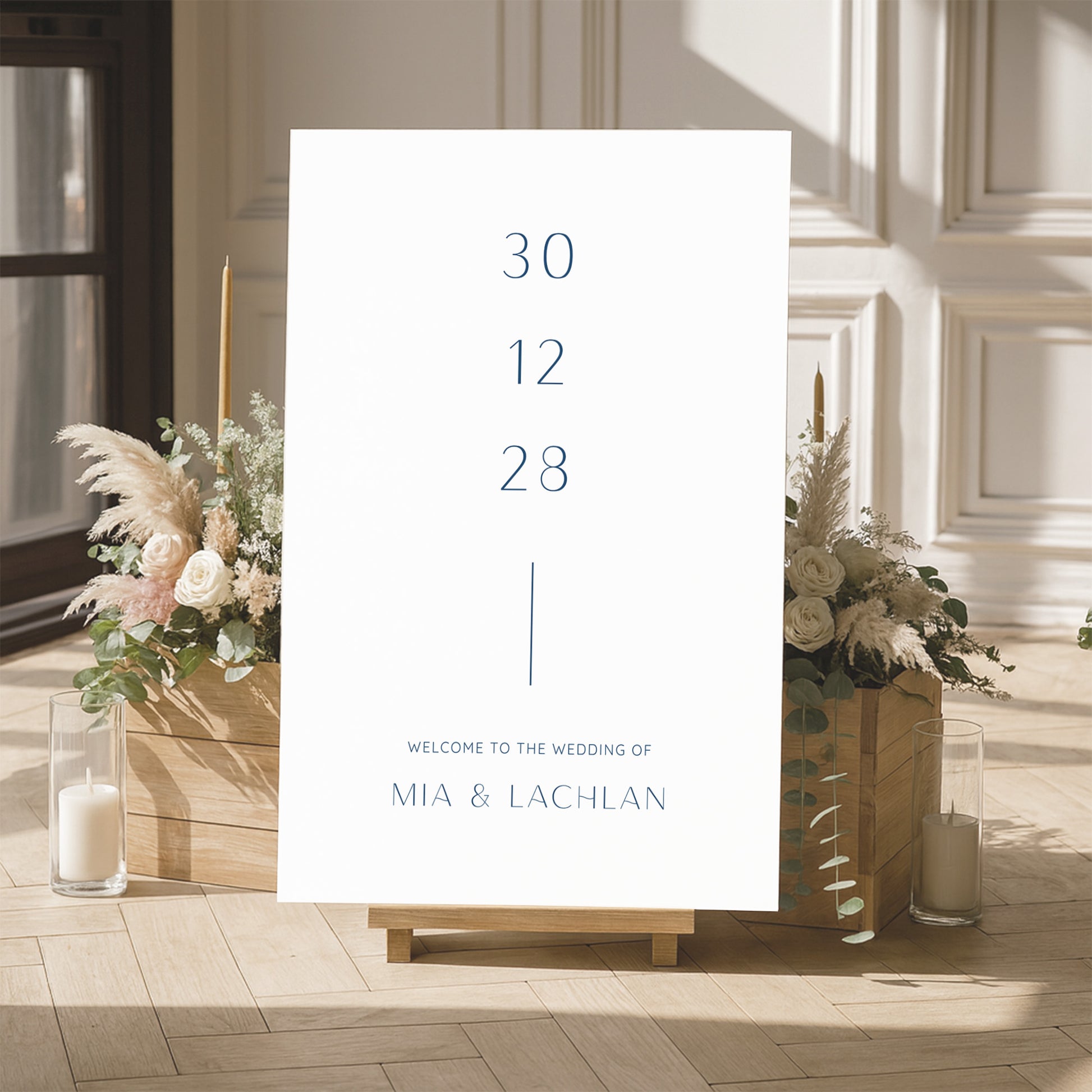 Wedding welcome sign template with floral arrangements and candles in a room.
