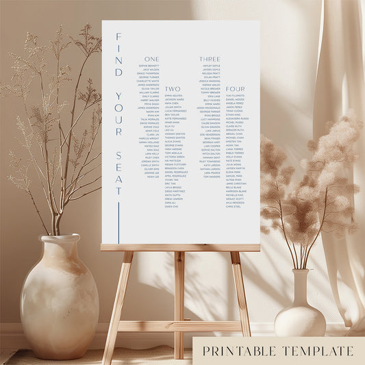 Printable long tables wedding seating chart sign on an easel with floral arrangements in a room setting.