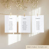 Three white seating chart cards with printed names, clipped to a string with pegs, against a neutral background.