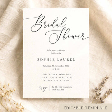 Elegant bridal shower invitation template on textured card on fabric background.
