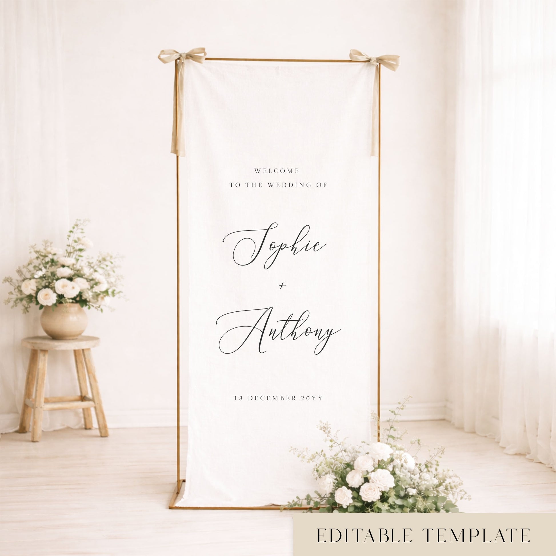 Elegant wedding linen welcome sign hanging from a gold frame.