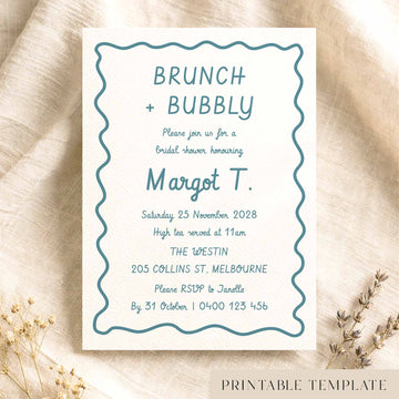 Whimsical hand-drawn bridal shower invitation template on textured card on fabric background.
