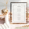 Framed bar menu template with decorative floral elements in a light table setting.