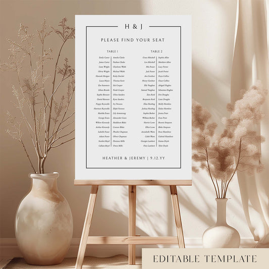 Modern long tables seating chart template on an easel with decorative vases and plants.