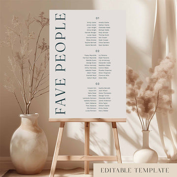 Modern 3-table long tables seating chart template on an easel with decorative vases and plants.
