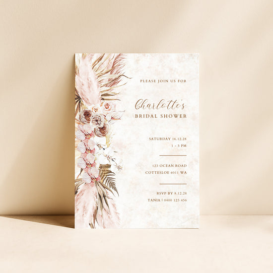 Modern bridal shower invitation card with pink florals on a beige background.
