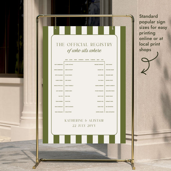 A preppy green stripe horseshoe seating chart hung on a gold display stand outside a city building entrance