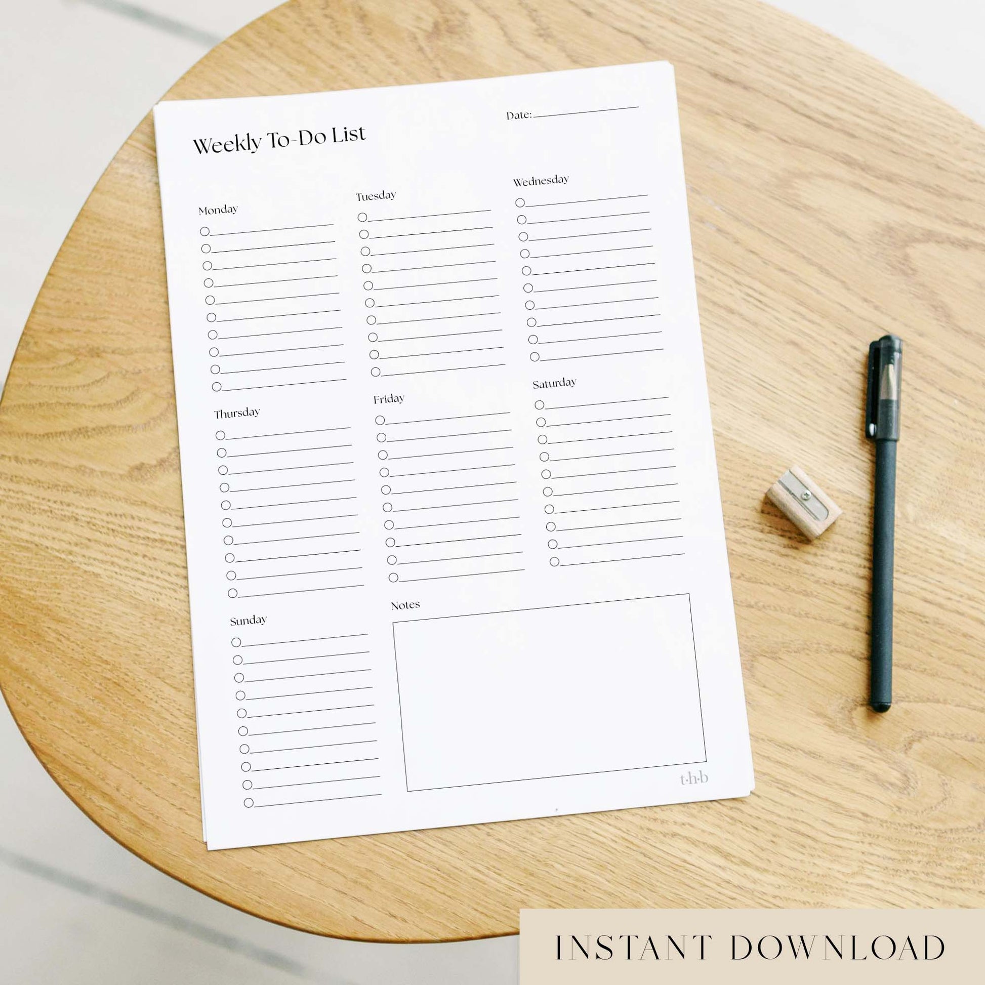 Printable weekly to-do list on a wooden surface with a pen and eraser.