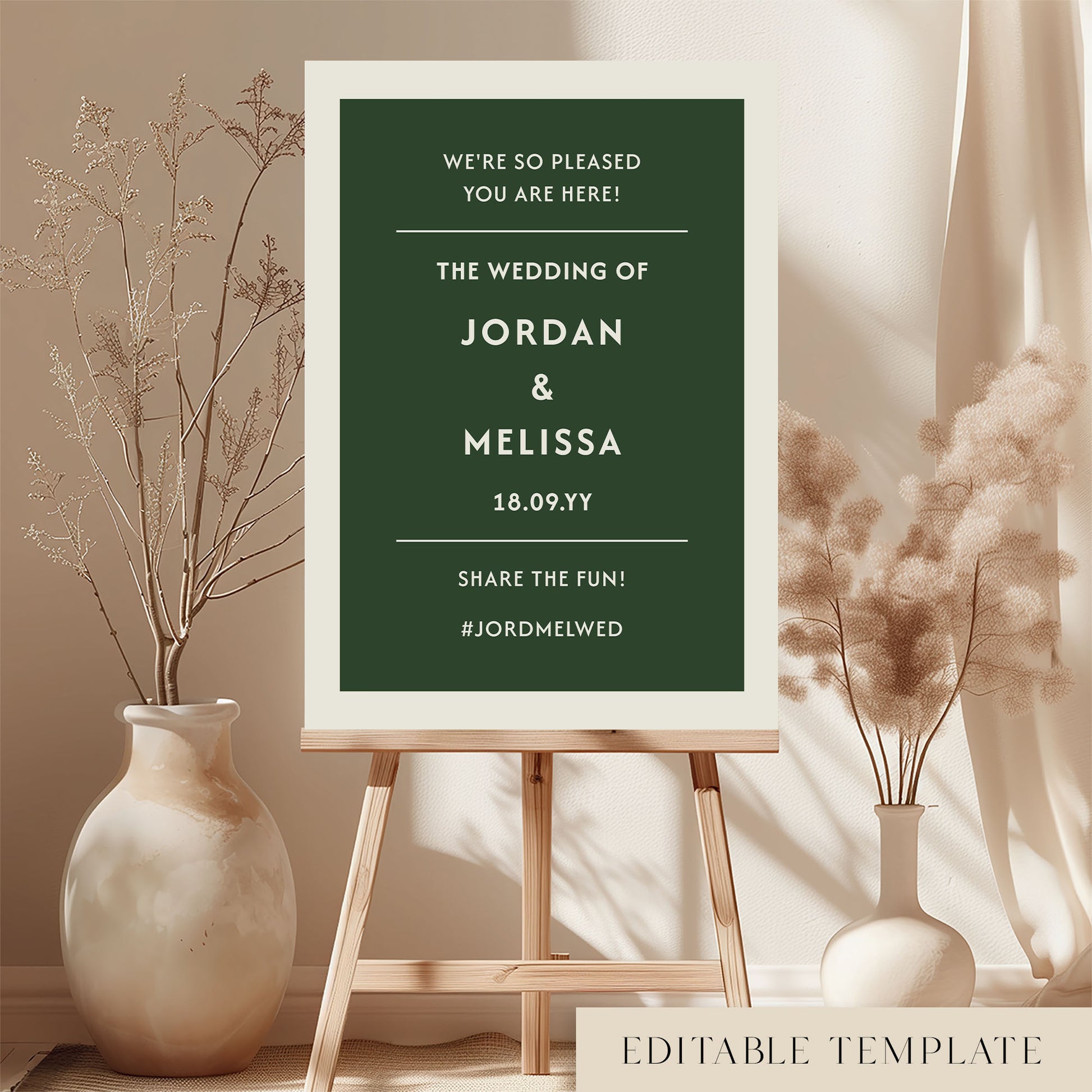 DIY wedding welcome sign template in forest green and cream displayed on a wooden easel. Features the Renard minimalist design in a bright, modern room with dried botanicals. Printable A1 or A2 size by The Hello Bureau.