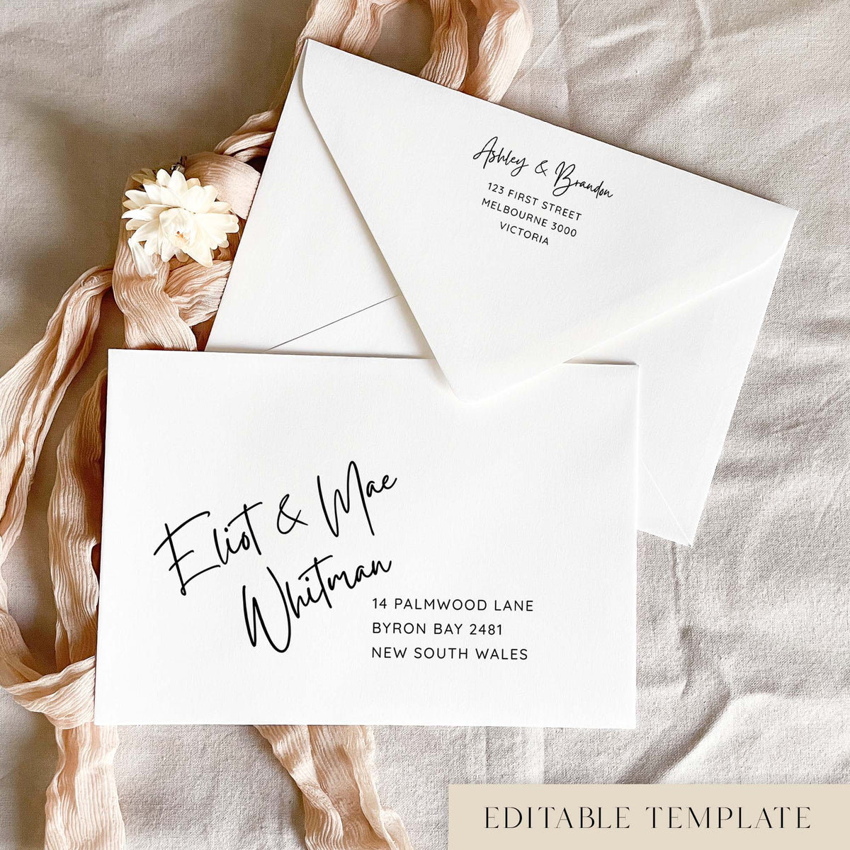 Casual handwriting editable wedding envelope address template in Canva, with black text on a white envelope. The guest names are in relaxed handwritten script with a simple address beneath, and the back flap shows a matching return address, styled with blush pink ribbon and a cream dried flower.