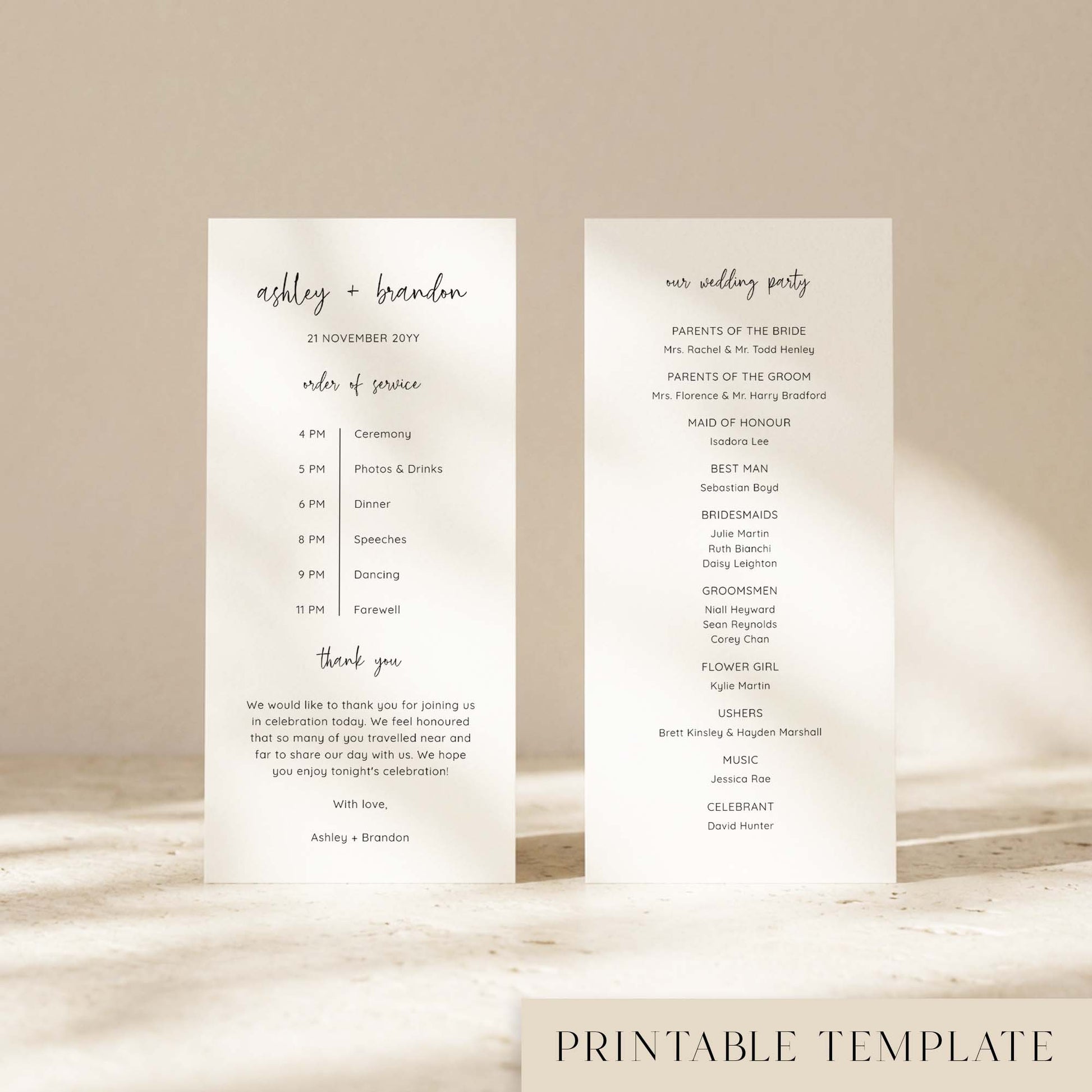Two DL-sized wedding program cards standing upright on a textured surface with soft natural light creating shadows across the background.