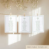 Three white seating chart cards with printed names, clipped to a string with pegs, against a neutral background.