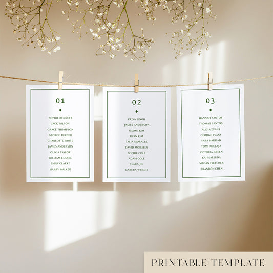 Three white seating chart cards with printed names, clipped to a string with pegs, against a neutral background.