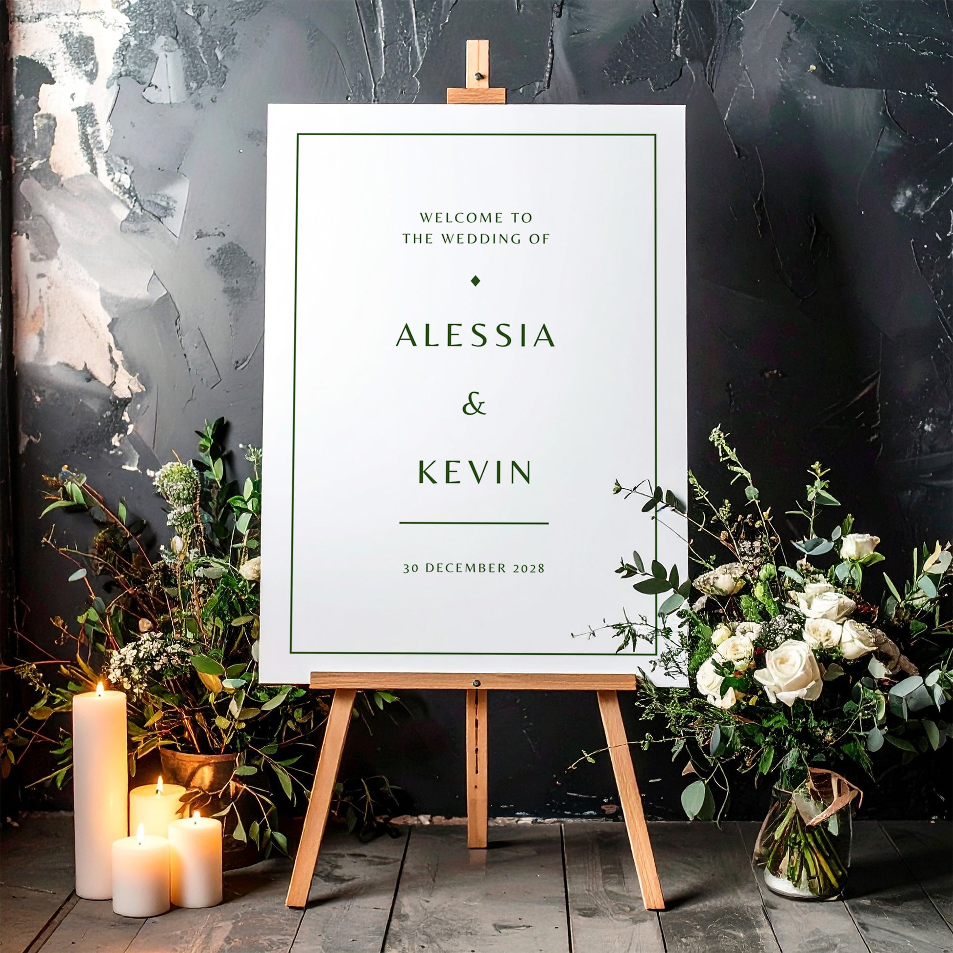 Printable wedding welcome sign on an easel with floral arrangements in a room setting.