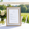 Printable wedding menu template in a gold frame on a soft pink tablecloth with dried florals and modern decorative accents.