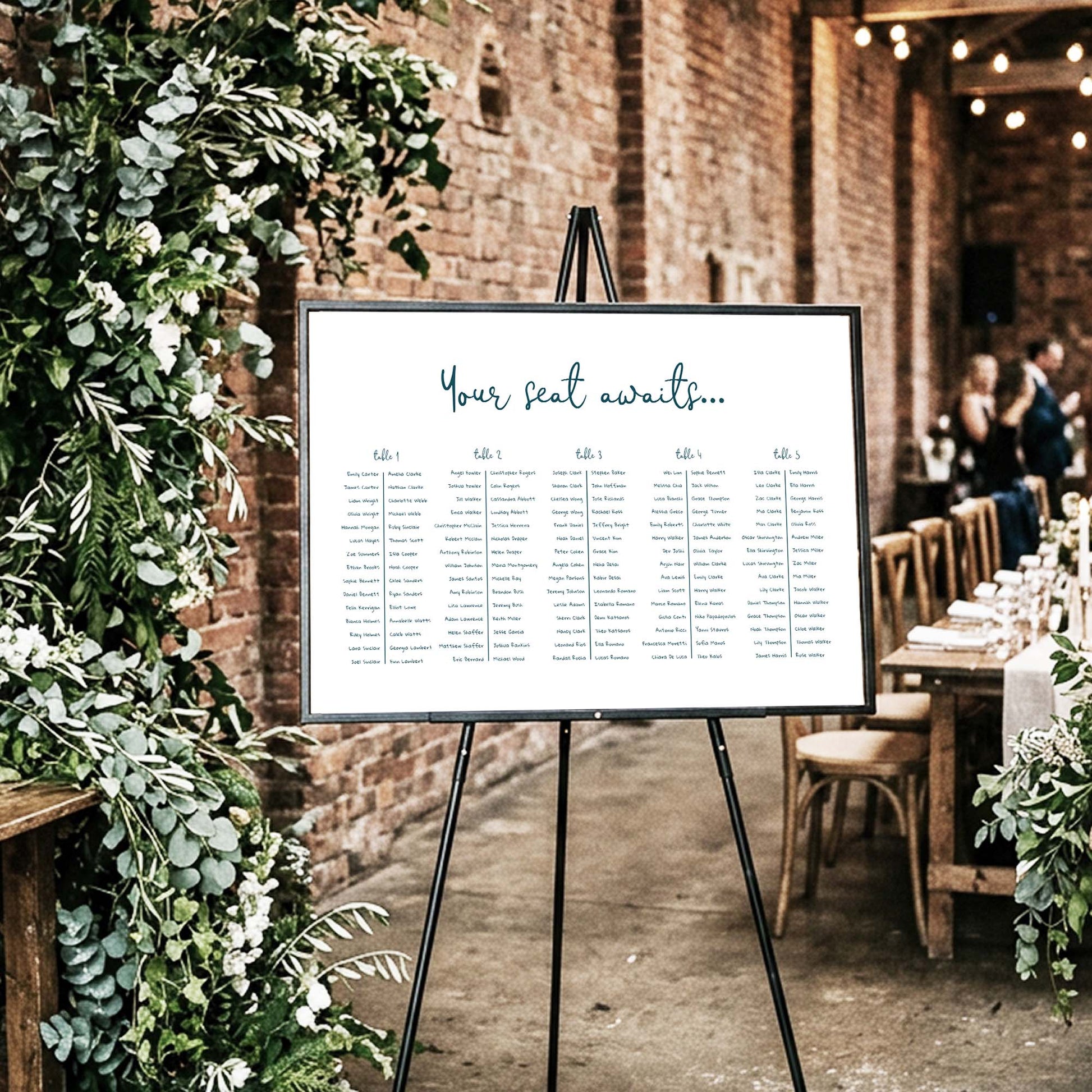 DIY long tables wedding seating chart template styled at an indoor wedding venue.