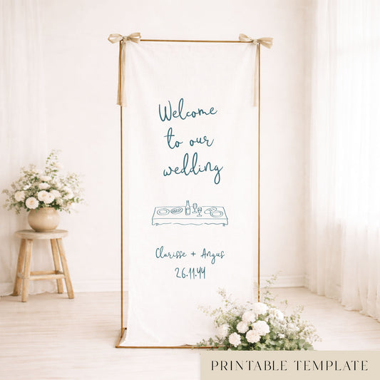 Gold frame with a hanging white whimsical linen wedding welcome sign.