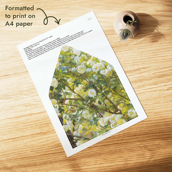 Painted rose garden wedding envelope liner PDF formatted to print on A4 paper, with a detail from a Peder Severin Krøyer painting of white roses and branches, plus trim lines for a 5x7 euro flap envelope.