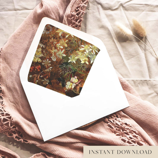 Printable vintage botanical envelope liner for 5x7 wedding invitations, with a painted wildflower design in rust brown, cream and olive green, shown inside a white envelope on dusty pink fabric.